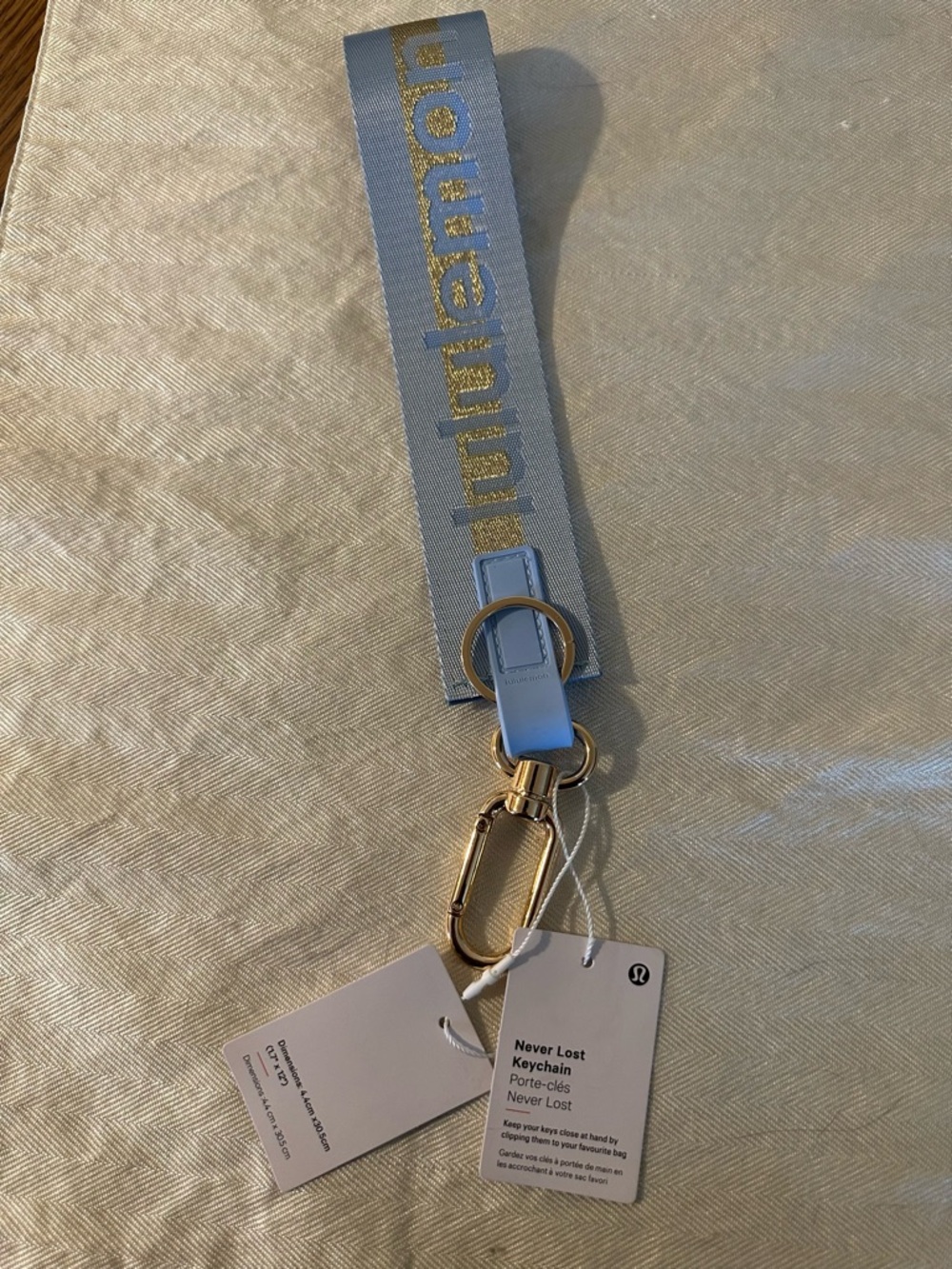 lululemon athletica Never Lost Keychain Wristlet - Light Blue with Gold Hardware